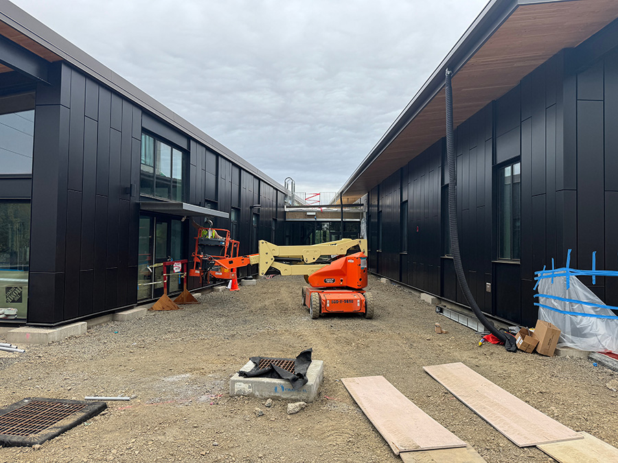 Long Painting work on a modern commercial building exterior in the Willamette Valley