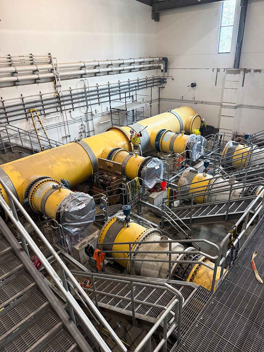 Coated yellow industrial piping and catwalks at a Willamette facility